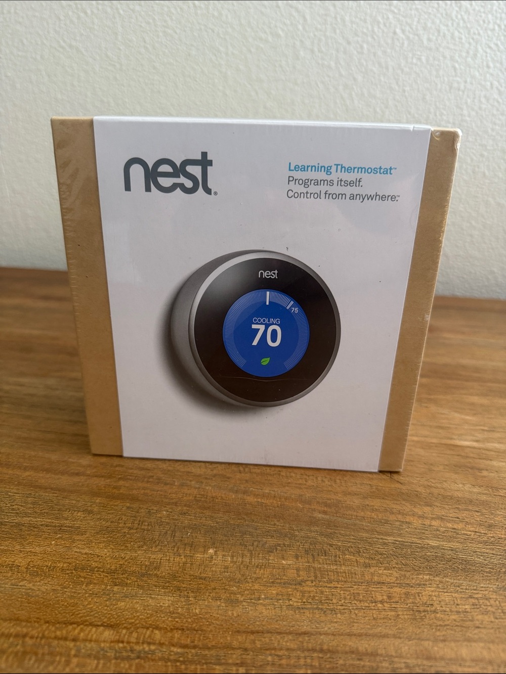 NEST Fragrances box with orange-blue thermostat image